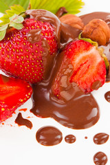 beautiful delicious cut strawberry with leaf and nuts on white b