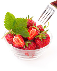 Fresh and tasty strawberries with leaf in plate