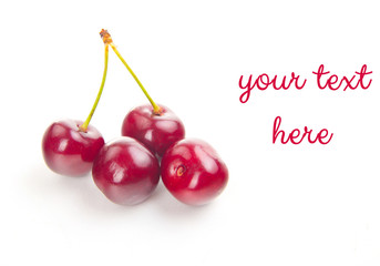 two isolated red cherries