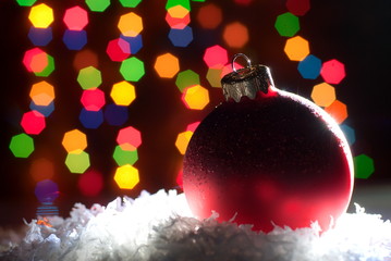 Christmas toys in the snow with a Christmas tree with garlands o