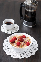 Cereal with strawberries and raspberries for breakfast