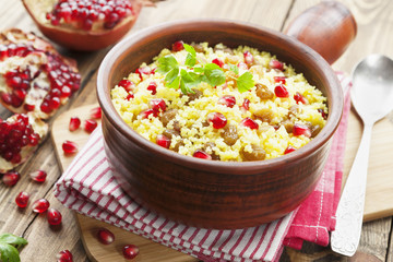 Couscous with pomegranate, raisins and spices
