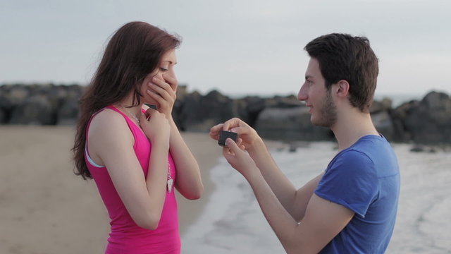 man declares his love to a woman. man gives a ring to a woman. marriage proposal