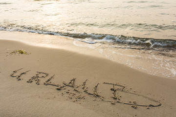 Schriftzug am Strand