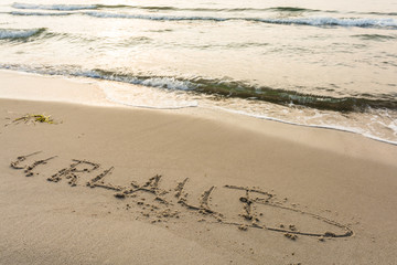 Schriftzug am Strand
