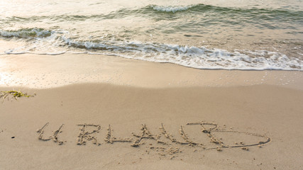 Schriftzug am Strand