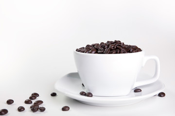 Coffee cup and beans on a white background.