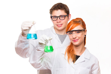 Two chemists holding a test tube in a lab