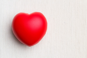 Red heart on cloth background