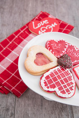 Plate of valentine cookies on rustic table