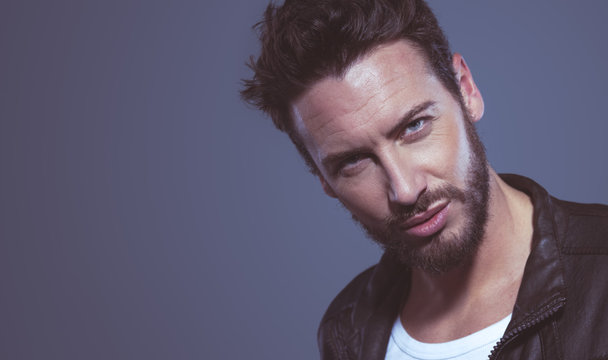 Cool attractive man in leather jacket