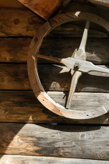 Wooden wheel on the wall