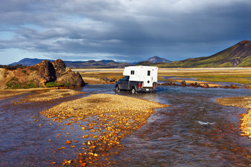 Car wades river in Landmannalaugar, Iceland © jarcosa