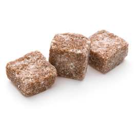 Brown lump cane sugar cube isolated on white background cutout