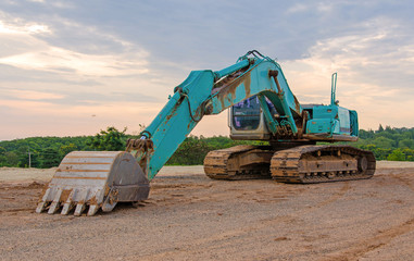 Excavator construction equipment park at worksite