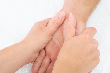 Physiotherapist Massaging Palm