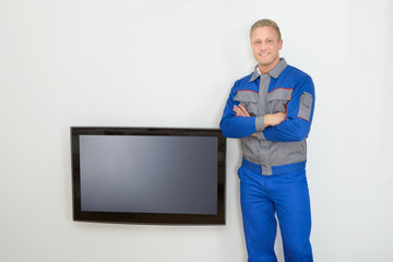 Technician Standing Near Television
