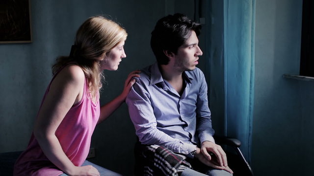 woman encourages disabled in a wheelchair to react and return to live