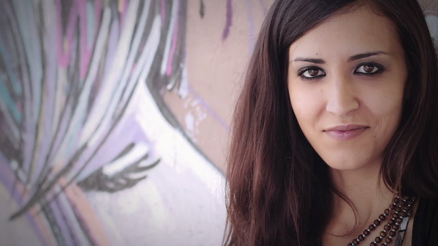 closeup of a beautiful woman  laughing at the camera - graffiti