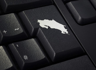 Keyboard with return key in the shape of Costa Rica.(series)