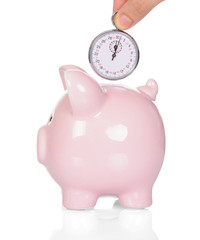Hand Depositing Time In Piggy Bank
