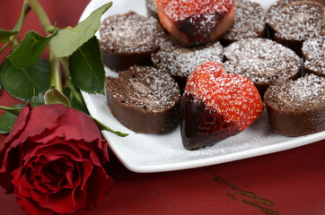 Valentine heart shaped strawberries with chocolate cake