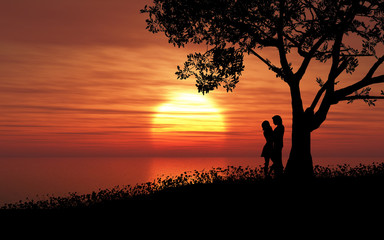 Fototapeta na wymiar Couple against a sunset sky
