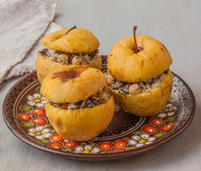 Baked apples with raisin, poppy seeds, rice and honey