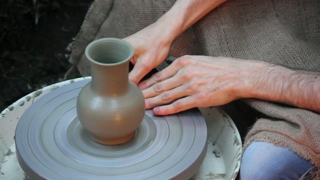 ancient potter - pot on the rotor wheel-A
