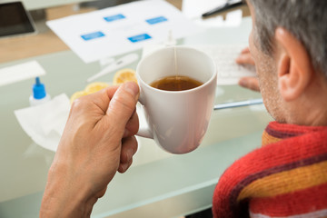 Businessman Holding Cup Of Tea