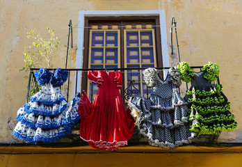 Traditional flamenco dresses at a house in Malaga, Spain - obrazy, fototapety, plakaty