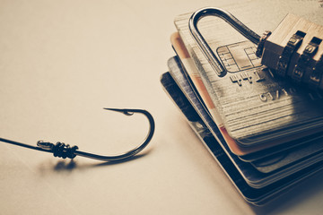 credit card phishing - lock on credit cards with a fish hook