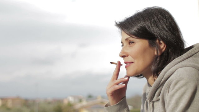 pensive woman smoking