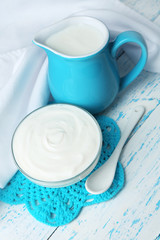 Dairy products on wooden table background