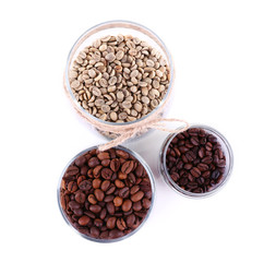 Coffee beans in glass jars isolated on white