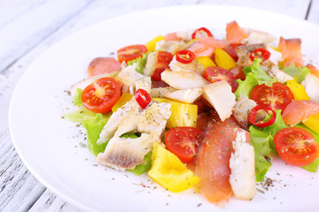 Fresh fish salad with vegetables