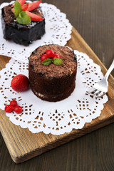 Yummy chocolate cupcake on table
