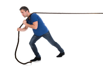 Portrait Of A Man Pulling Rope