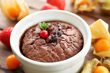 Hot chocolate pudding with fondant centre on table, close-up