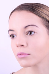 Obraz premium Applying makeup on female face, on white background