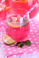 Pink lemonade in glasses on table close-up