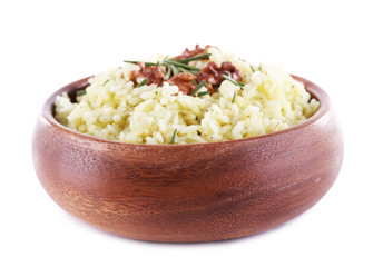 Rice with walnuts and rosemary in plate isolated on white