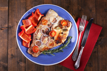 Dish of Pangasius fillet with spices and vegetables