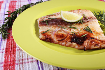 Dish of Pangasius fillet with rosemary and lime