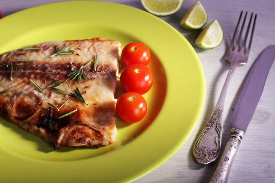 Dish of Pangasius fillet with rosemary and cherry tomatoes in