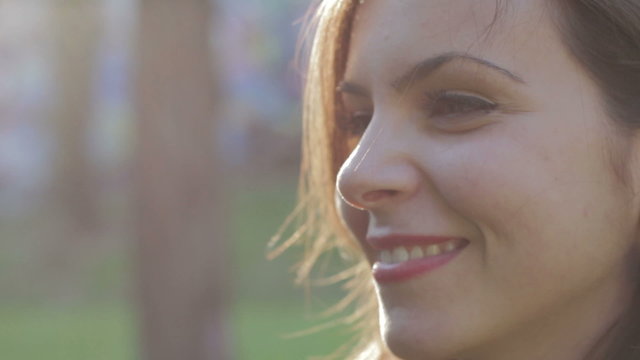 profile of beautiful woman that is smiling - wellness - happiness - laugher