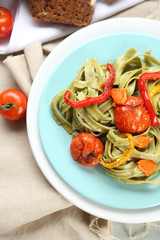 Tasty pasta with pepper, carrot and tomatoes