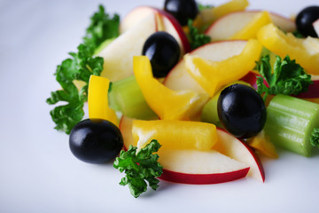 Waldorf salad with olive on plate close up