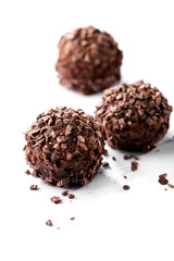 chocolates with crumbs close-up on white background