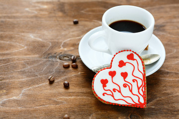 Sweet Cookie for Valentine's day with coffee on plywood